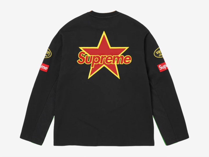 All cotton jersey with cotton mesh panels at chest and sleeves. Embroidered logo patches on chest and sleeves. Embroidered graphics on front and printed graphics on sleeves. Embroidered logo appliqué at back.