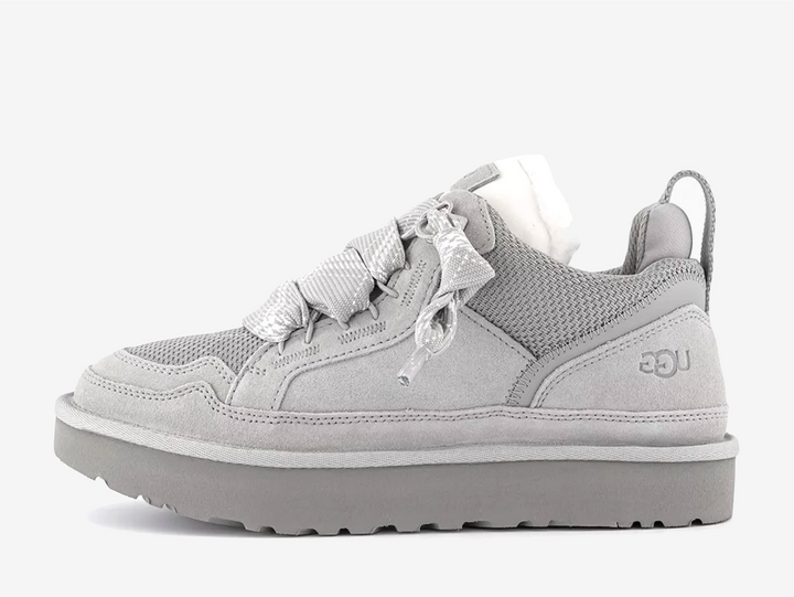 The newest edition of the UGG Lowmel in Seal Grey, exclusive just to OFFICE, blends West Coast cool with eco-conscious design. Crafted from soft suede and recycled canvas mesh, this sneaker-boot hybrid features chunky laces, plush UGGplush™ lining, and a sugarcane EVA outsole for all-day comfort. Perfect for styling with relaxed cargos or oversized knits, it’s a laid-back essential with elevated edge.