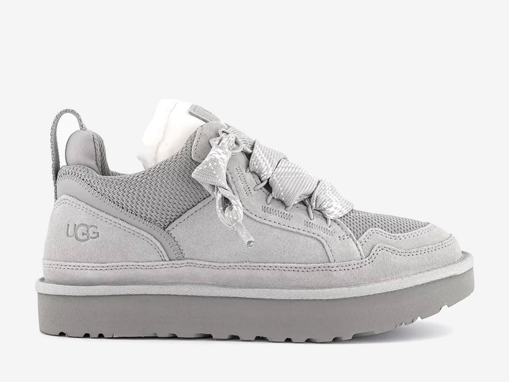 The newest edition of the UGG Lowmel in Seal Grey, exclusive just to OFFICE, blends West Coast cool with eco-conscious design. Crafted from soft suede and recycled canvas mesh, this sneaker-boot hybrid features chunky laces, plush UGGplush™ lining, and a sugarcane EVA outsole for all-day comfort. Perfect for styling with relaxed cargos or oversized knits, it’s a laid-back essential with elevated edge.