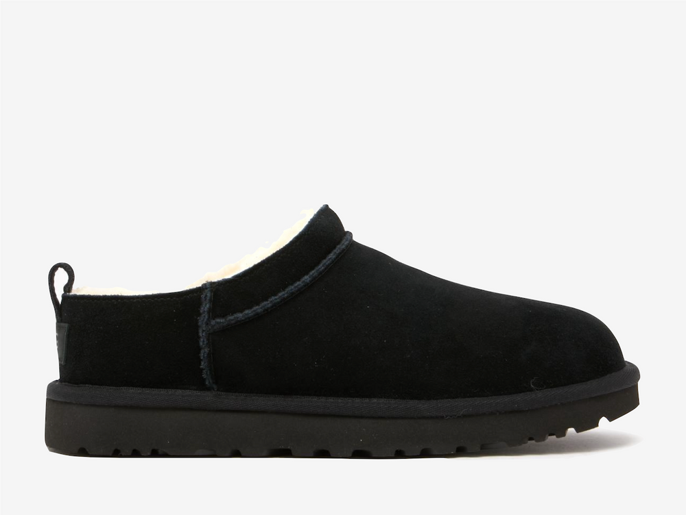 Redefining cosy street style, the UGG Classic Micro Boot Black wraps signature comfort in a sleek, ankle bootie profile. Premium black suede creates a canvas while the plush sheepskin lining delivers that unmistakable UGG embrace against the skin, adapting to your body temperature with natural thermoregulation perfect for winter wear.