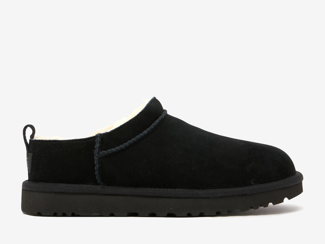 Redefining cosy street style, the UGG Classic Micro Boot Black wraps signature comfort in a sleek, ankle bootie profile. Premium black suede creates a canvas while the plush sheepskin lining delivers that unmistakable UGG embrace against the skin, adapting to your body temperature with natural thermoregulation perfect for winter wear.