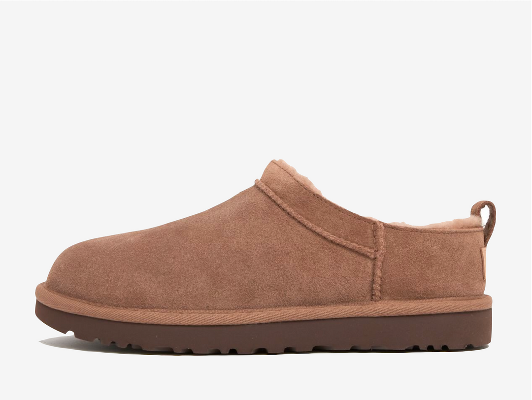 Lined with cloud soft genuine sheepskin that adapts to your body's temperature, these boots create their own microclimate whether worn barefoot or with socks, perfect for winter comfort and beyond. The innovative sugarcane EVA outsole delivers weightless support while maintaining that unmistakable feeling, turning everyday errands into opportunities for effortless fashion.