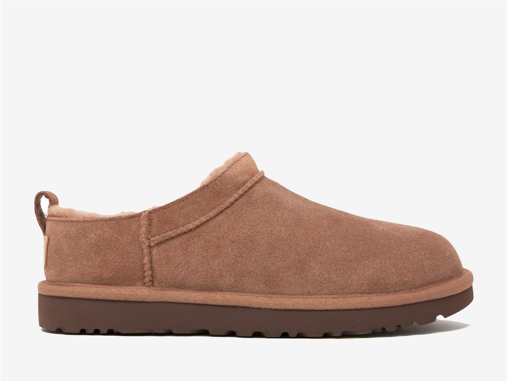 Lined with cloud soft genuine sheepskin that adapts to your body's temperature, these boots create their own microclimate whether worn barefoot or with socks, perfect for winter comfort and beyond. The innovative sugarcane EVA outsole delivers weightless support while maintaining that unmistakable feeling, turning everyday errands into opportunities for effortless fashion.