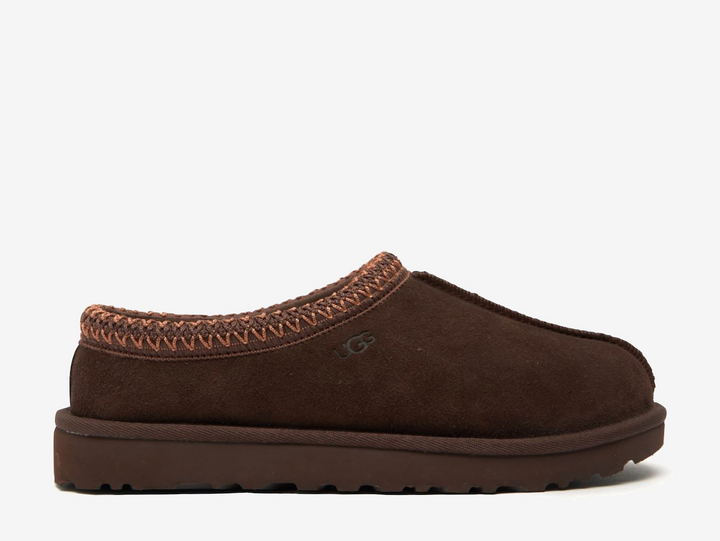 The Tasman II slippers are a sturdy and comfortable slip-on silhouette featuring the same durable outsole as the iconic UGG Classic Boot. Crafted with velvety suede, plush natural wool and embroidered braided detailing. In a stunning 'Burnt Cedar' colourway.