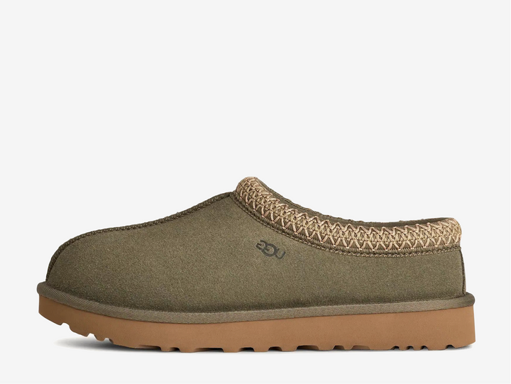 The Tasman II slippers are a sturdy and comfortable slip-on silhouette featuring the same durable outsole as the iconic UGG Classic Boot. Crafted with velvety suede, plush natural wool and embroidered braided detailing. In a stunning Moss Green colourway.