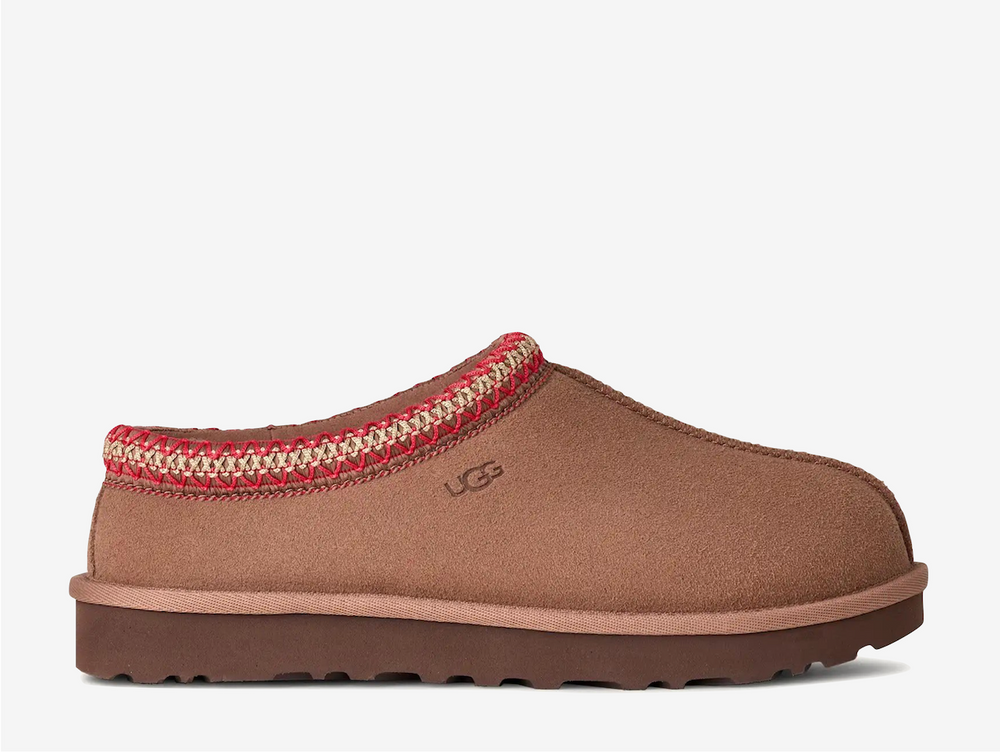 The Tasman II slippers are a sturdy and comfortable slip-on silhouette featuring the same durable outsole as the iconic UGG Classic Boot. Crafted with velvety suede, plush natural wool and embroidered braided detailing. In a stunning Rocky Oak colourway.