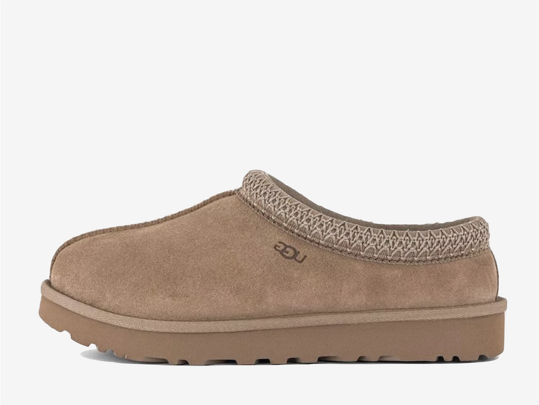 Exclusive UGG Tasman slippers in a light brown colour scheme, featuring plush sheep skin lining.