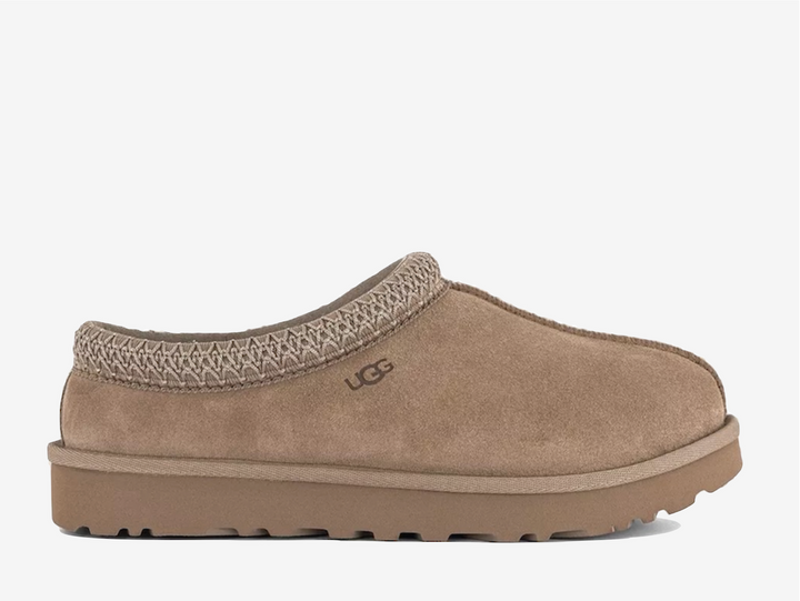 Exclusive UGG Tasman slippers in a light brown colour scheme, featuring plush sheep skin lining.