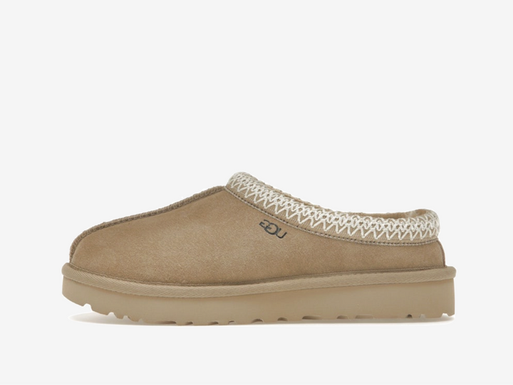 Exclusive UGG Slippers in a beige colourway.