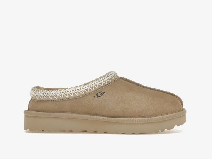 Exclusive UGG Slippers in a beige colourway.