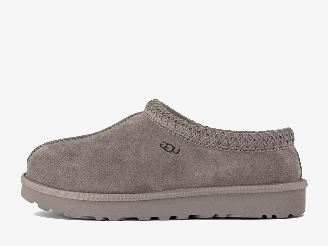 Exclusive UGG Tasman slippers in a light grey colour scheme, featuring plush sheep skin lining.