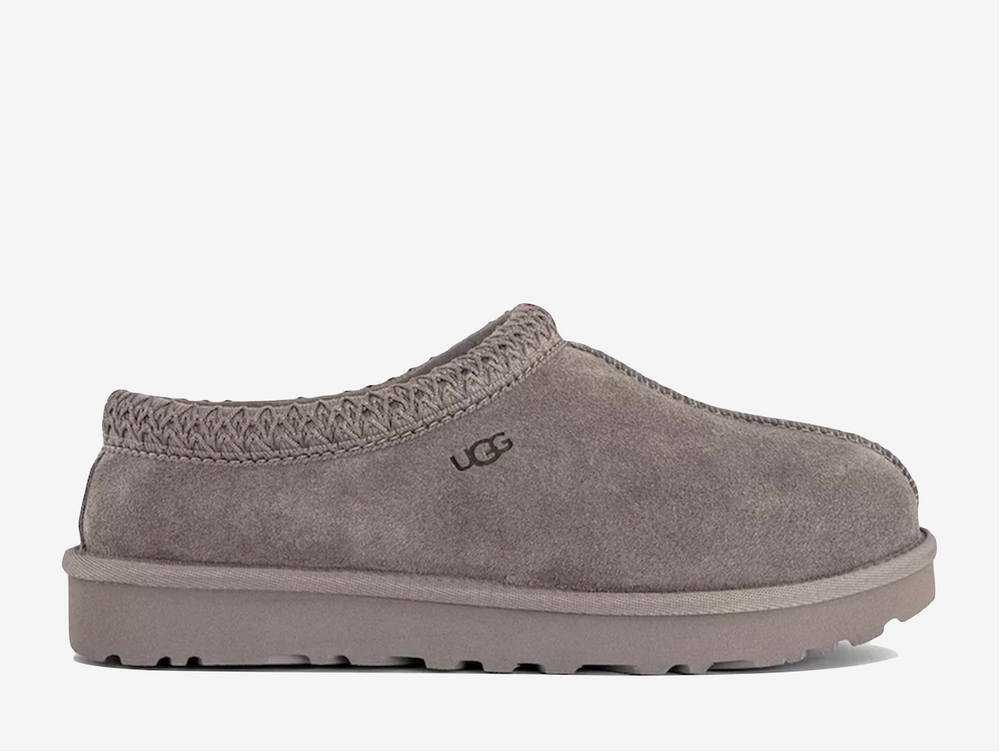 Exclusive UGG Tasman slippers in a light grey colour scheme, featuring plush sheep skin lining.