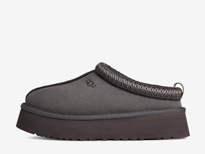 A fresh take on a favorite, the Tazz II features smooth suede, plush sheepskin lining, and a lightweight sugarcane EVA sole with an enhanced rocker shape. Finished with signature UGGbraid detailing, it delivers effortless comfort and style with every step.