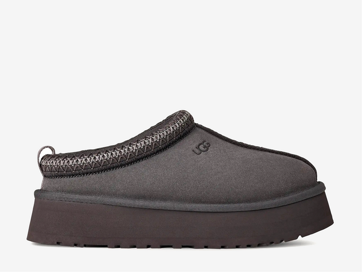 A fresh take on a favorite, the Tazz II features smooth suede, plush sheepskin lining, and a lightweight sugarcane EVA sole with an enhanced rocker shape. Finished with signature UGGbraid detailing, it delivers effortless comfort and style with every step.