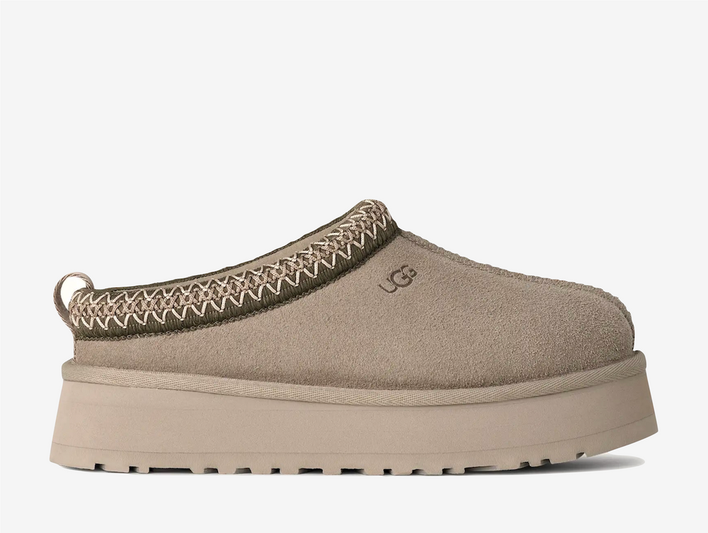 A fresh take on a favorite, the Tazz II features smooth suede, plush sheepskin lining, and a lightweight sugarcane EVA sole with an enhanced rocker shape. Finished with signature UGGbraid detailing, it delivers effortless comfort and style with every step.
