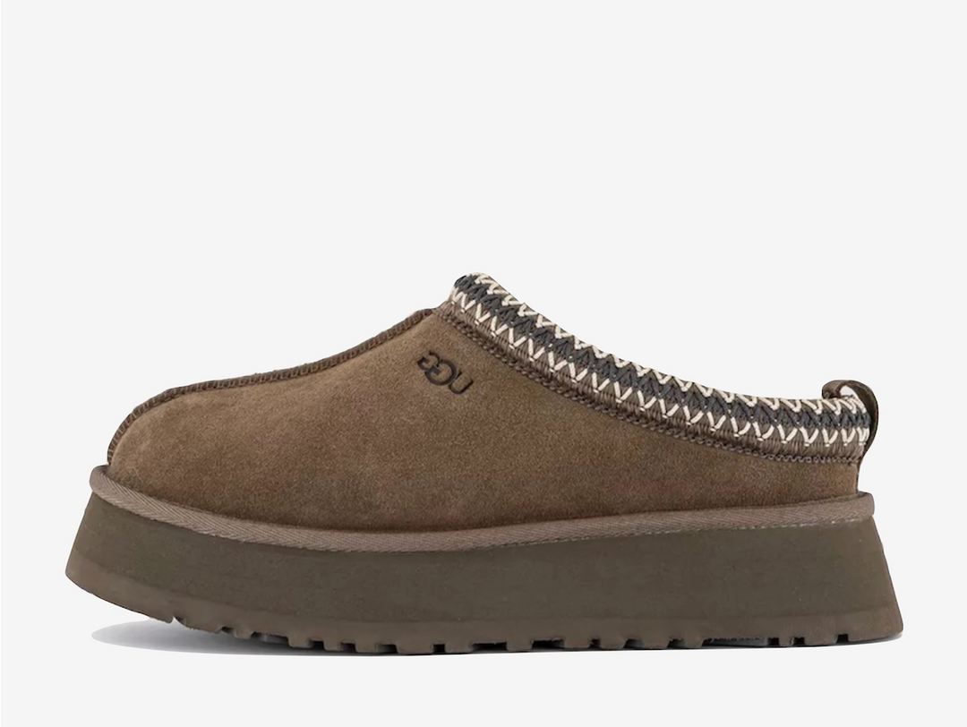 Exclusive UGG Tazz slippers in a dark brown and grey colour scheme, featuring plush sheep skin lining.