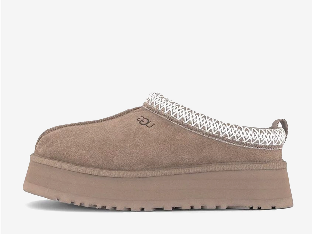 Exclusive UGG Tazz slippers in a light brown colour scheme, featuring plush sheep skin lining.