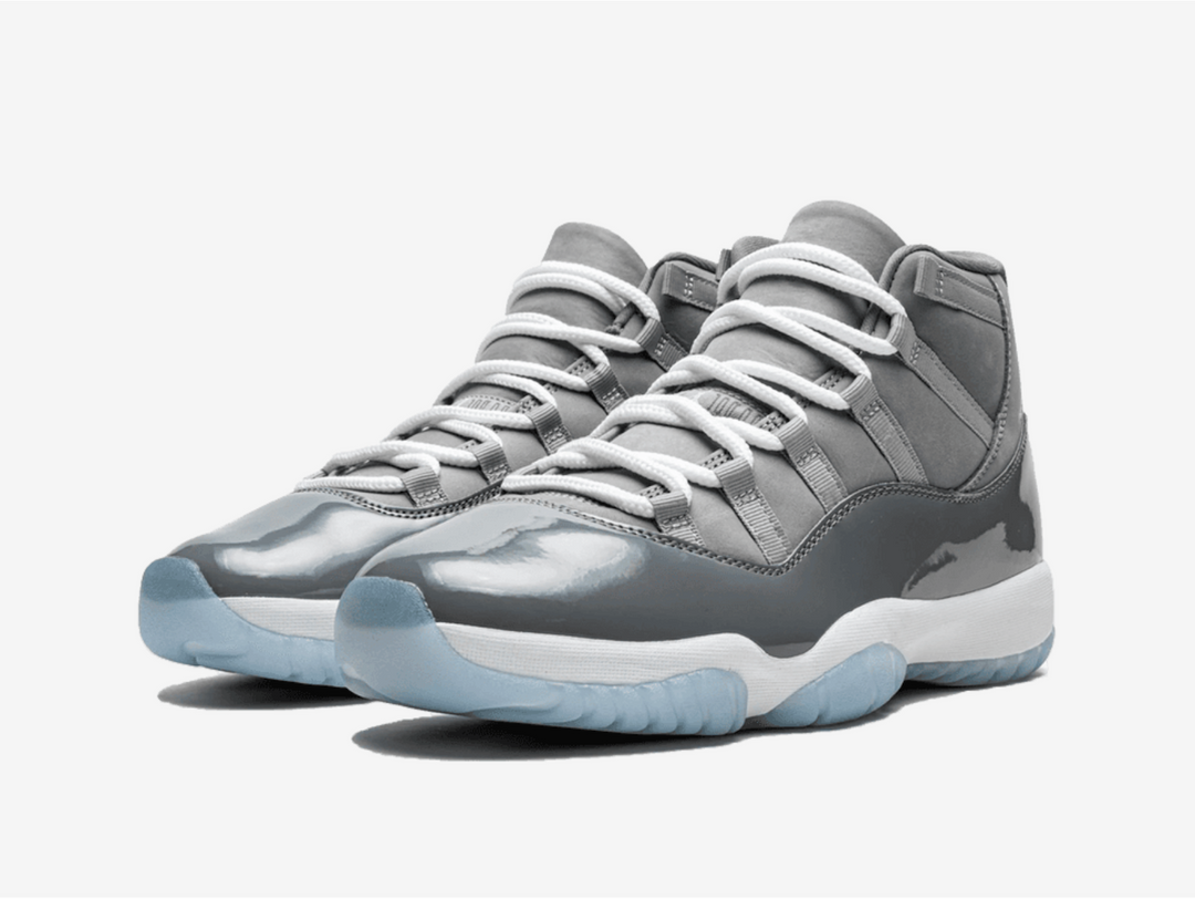 Timeless Jordan 11 sneakers in a classic grey and white colour scheme.