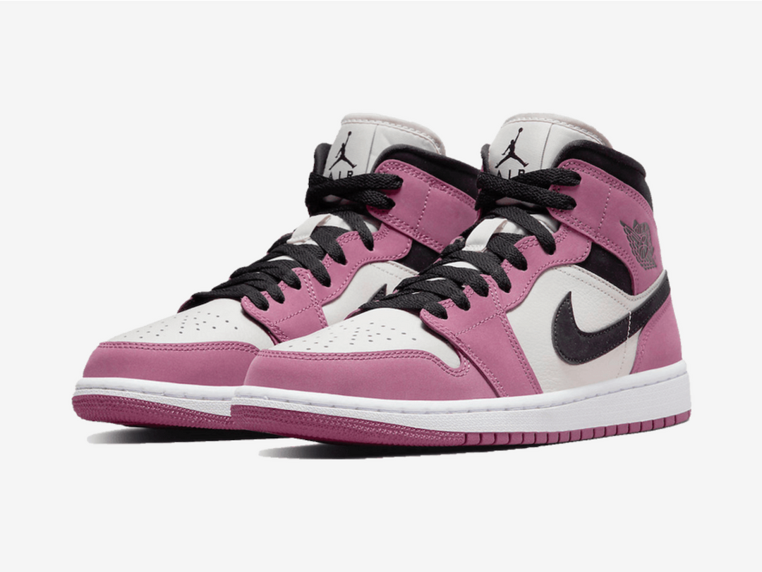 Classic Jordan 1 Mid shoes with a pink, white, and black colourway.