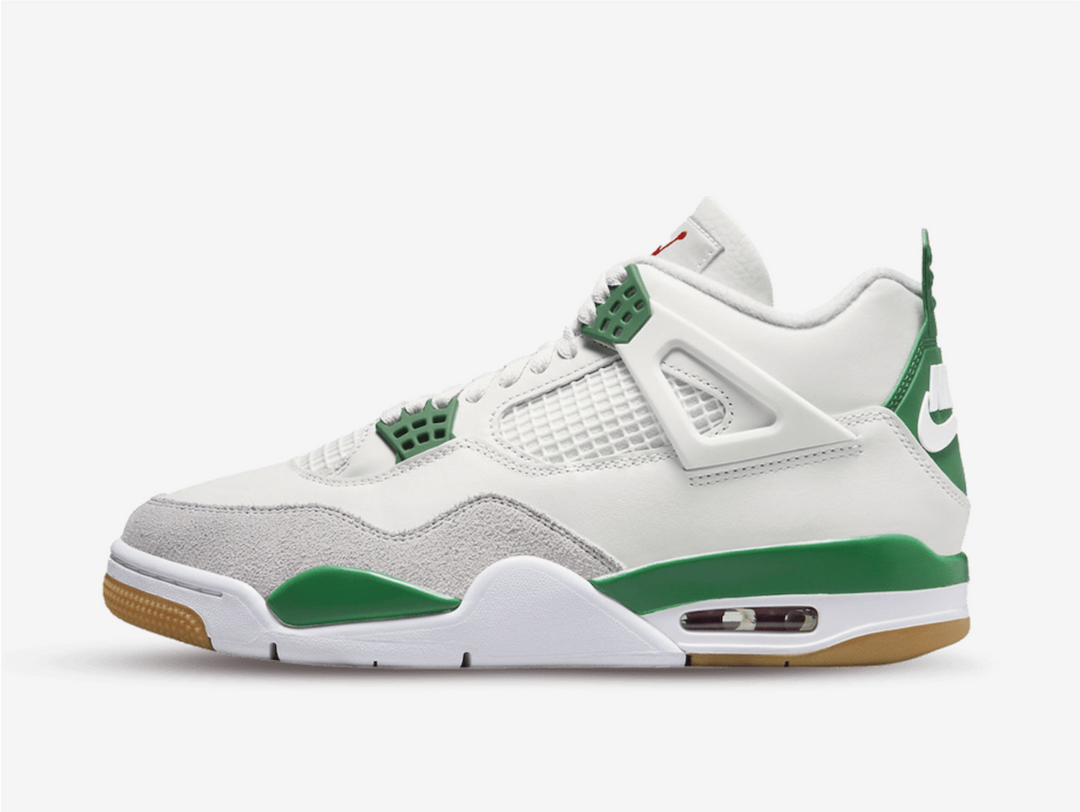 Timeless Jordan 4 sneakers in a classic green and white colour scheme.