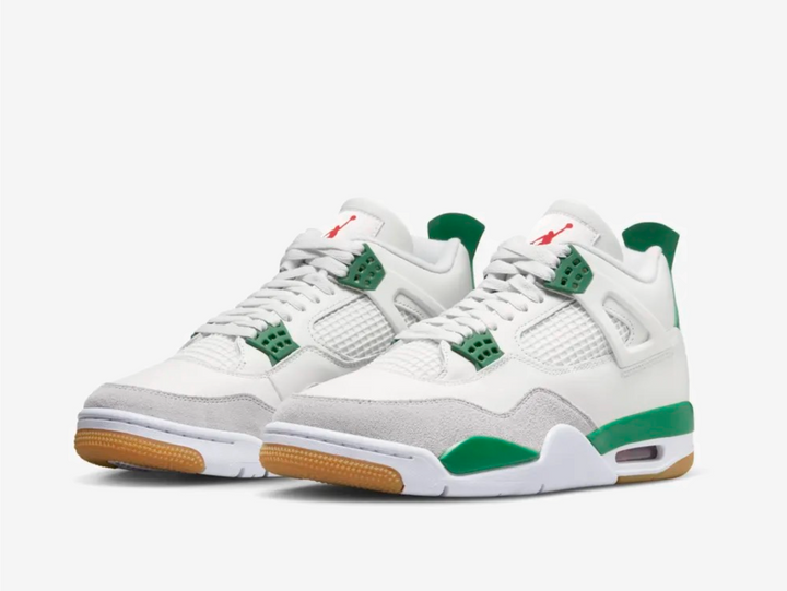 Timeless Jordan 4 sneakers in a classic green and white colour scheme.
