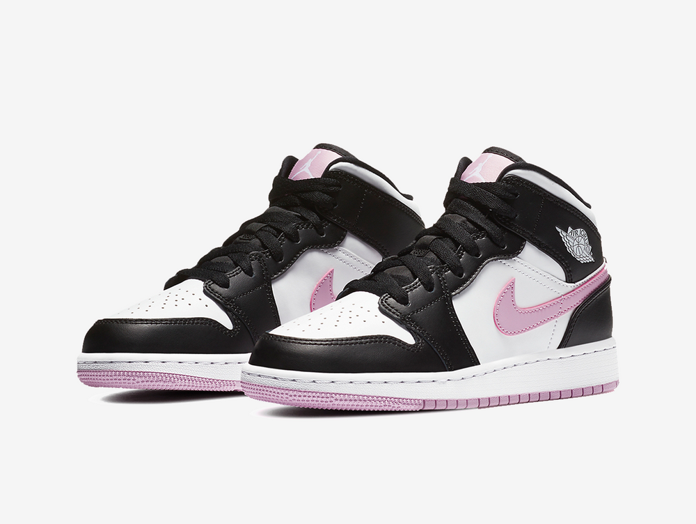 Timeless Air Jordan 1 Mid sneakers in a classic white, pink and black colour scheme.