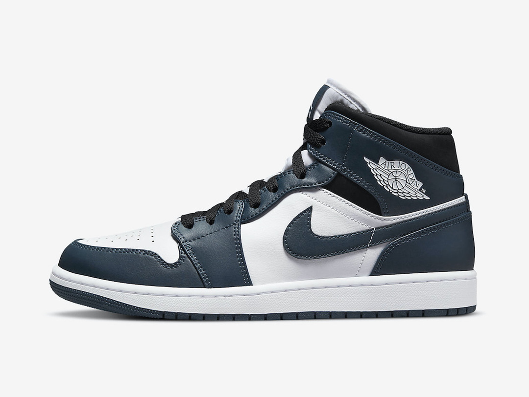 Timeless Air Jordan 1 Mid sneakers in a classic blue, white and black colour scheme.