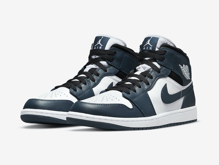 Timeless Air Jordan 1 Mid sneakers in a classic blue, white and black colour scheme.