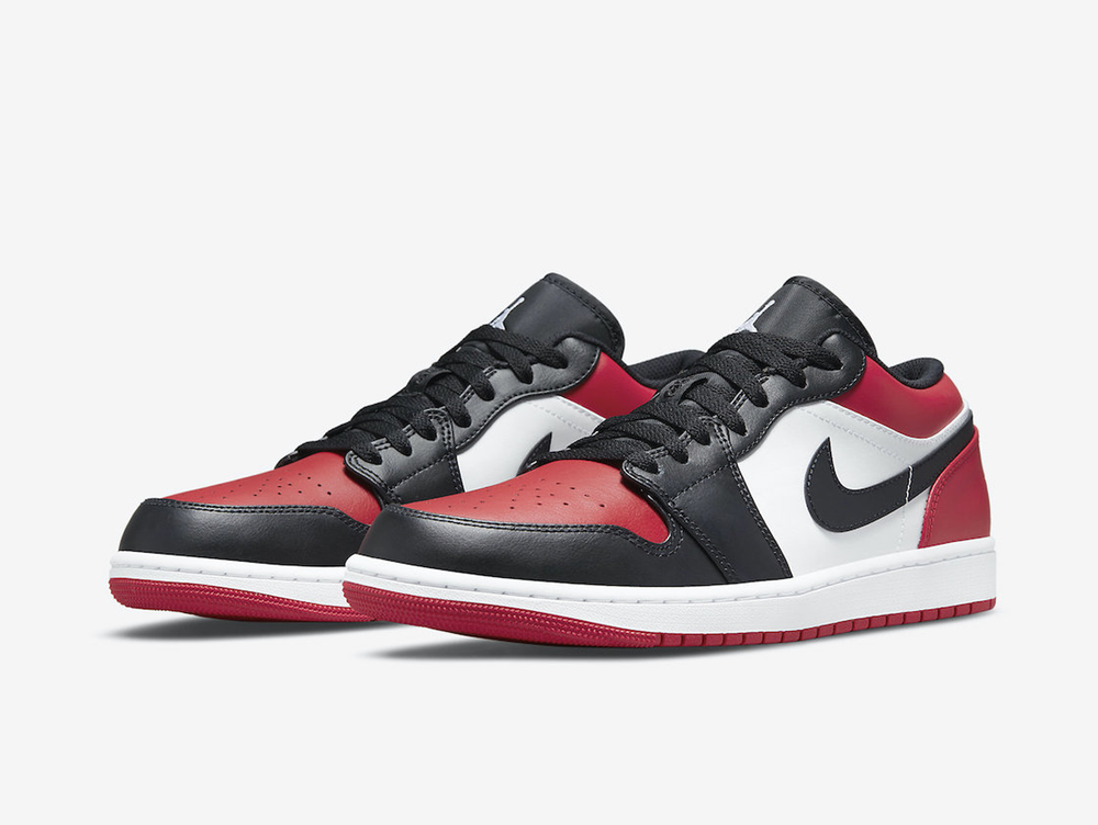 Classic Jordan 1 Low shoes with a red, white, and black colourway.