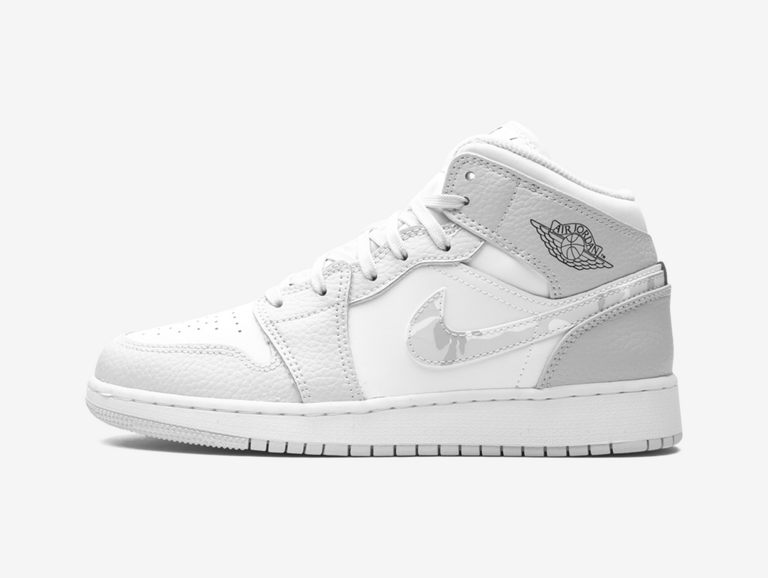 Timeless Air Jordan 1 Mid sneakers in a classic grey and white colour scheme.