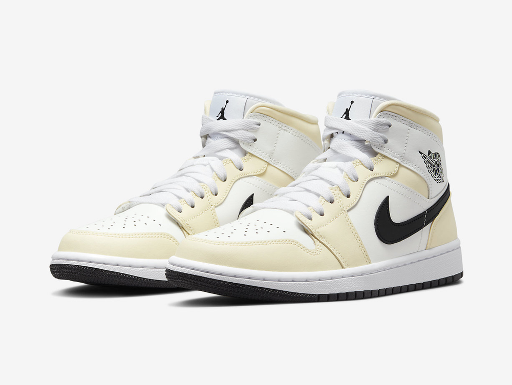 Exclusive Jordan 1 Mid shoes with a unique white and yellow colour scheme.