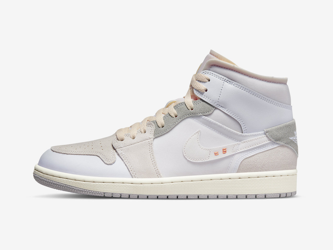 Classic Jordan 1 Mid shoes with a neutral colourway.