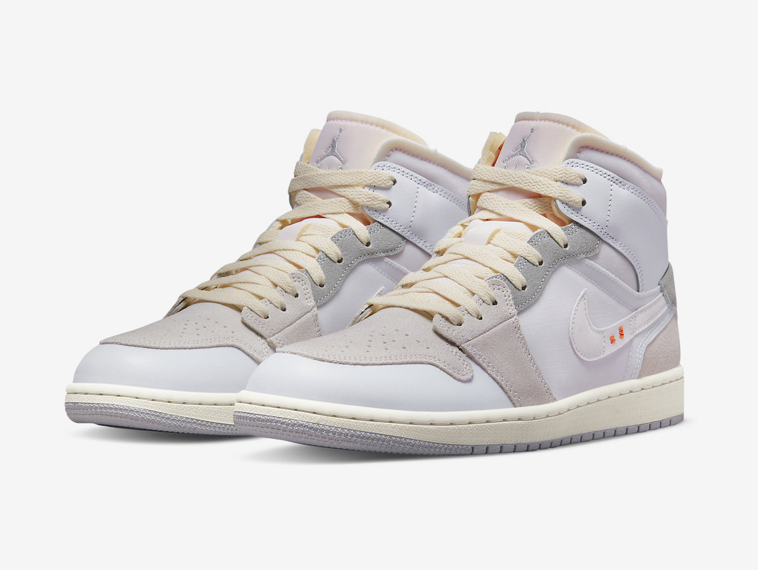 Classic Jordan 1 Mid shoes with a neutral colourway.