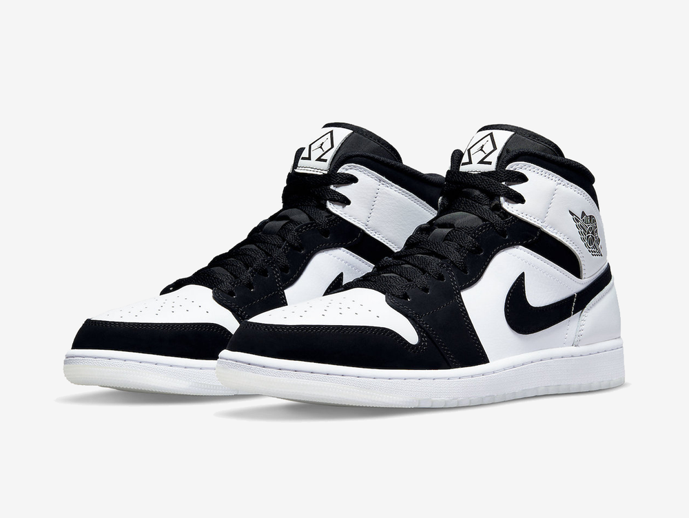 Classic Jordan 1 Mid shoes with a white and black colourway.