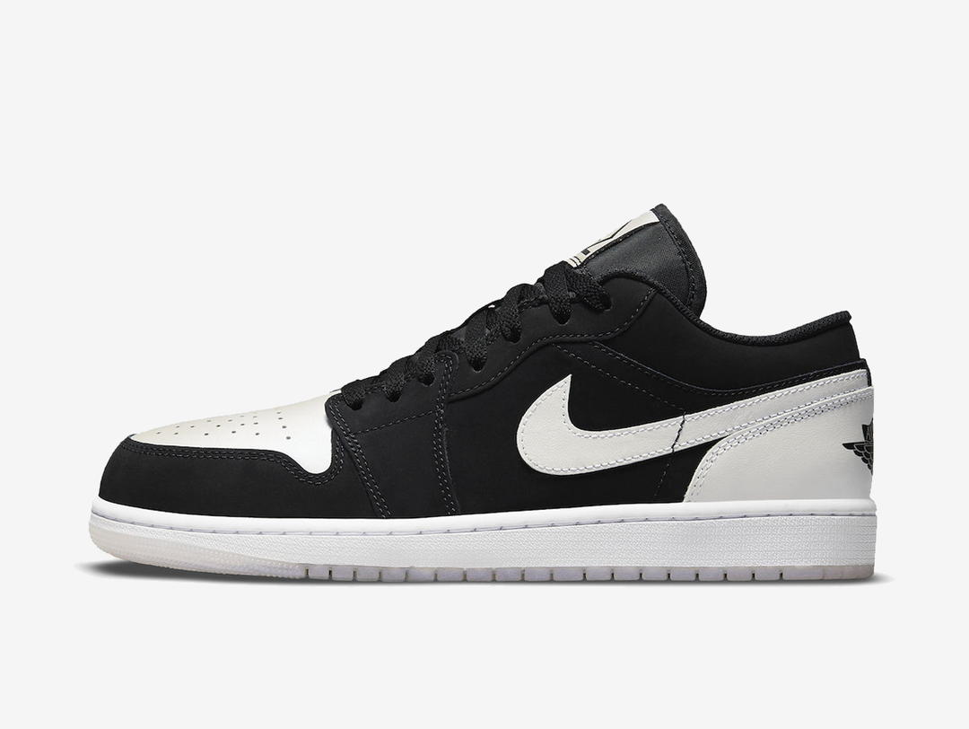 Timeless Air Jordan 1 Low sneakers in a classic white and black colour scheme.