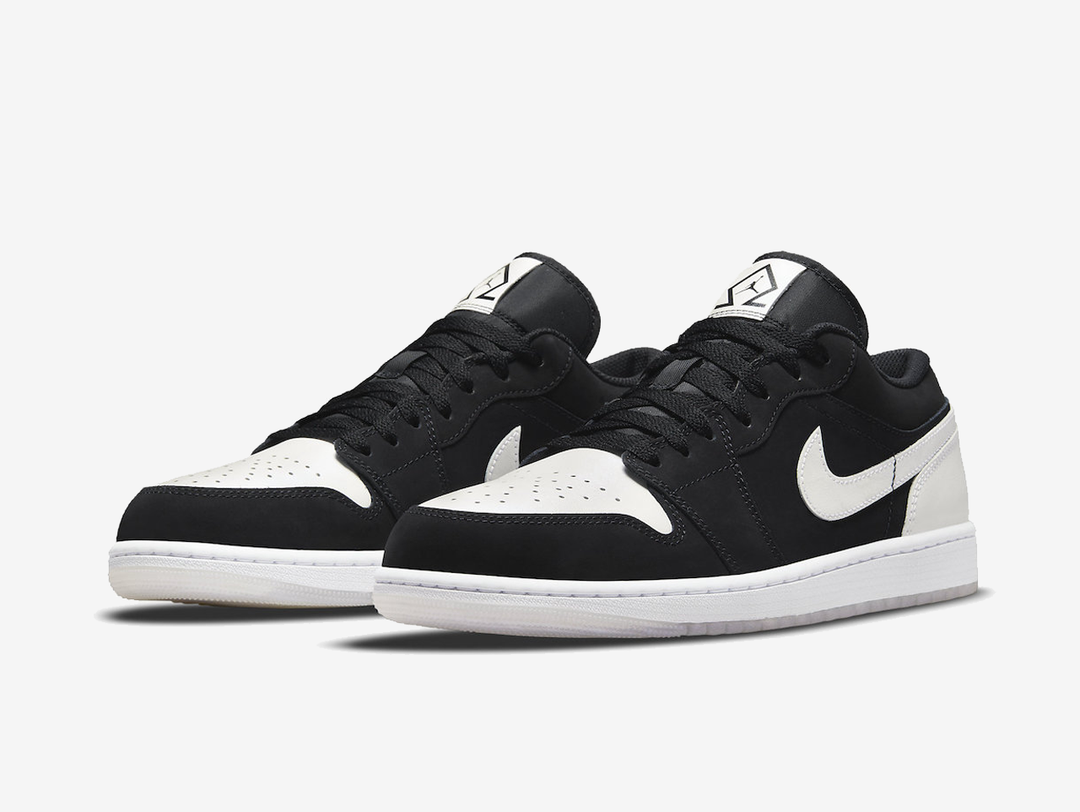 Timeless Air Jordan 1 Low sneakers in a classic white and black colour scheme.