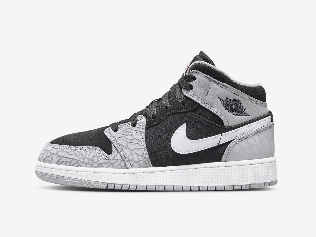 Timeless Air Jordan 1 Mid sneakers in a classic grey and black colour scheme.