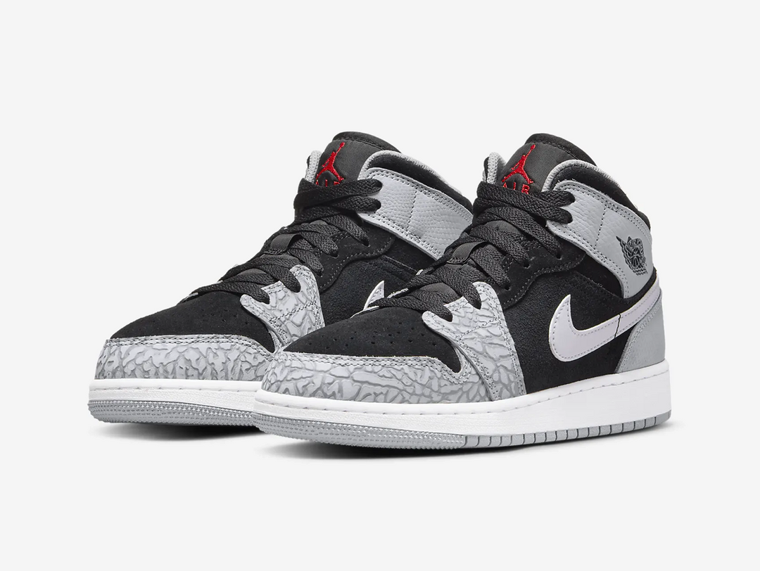 Timeless Air Jordan 1 Mid sneakers in a classic grey and black colour scheme.