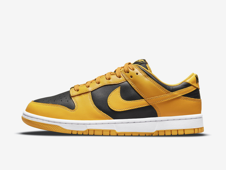 Timeless Nike Dunk sneakers in a classic yellow and black colour scheme.
