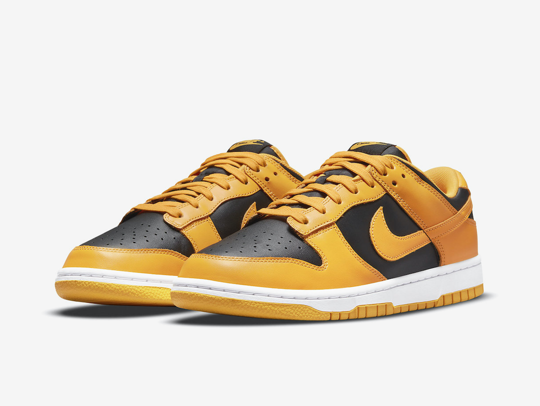 Timeless Nike Dunk sneakers in a classic yellow and black colour scheme.