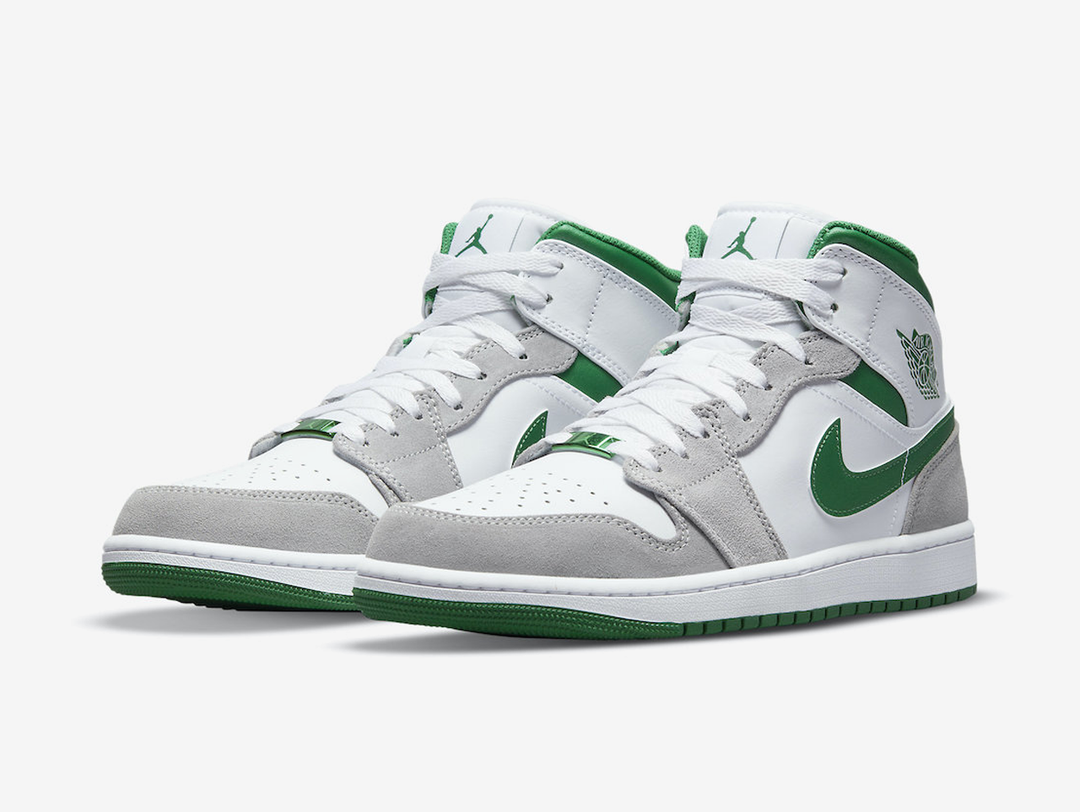 Classic Jordan 1 Mid shoes with a white and green colourway.