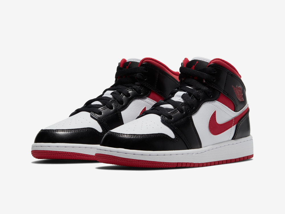 Classic Jordan 1 Mid shoes with a red, white, and black colourway.