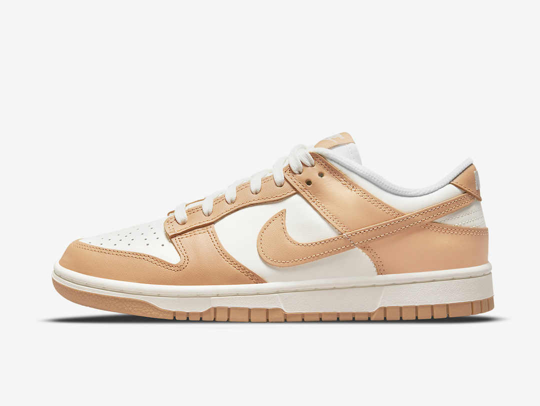 Classic Nike Dunk shoes with a white and tan colourway.