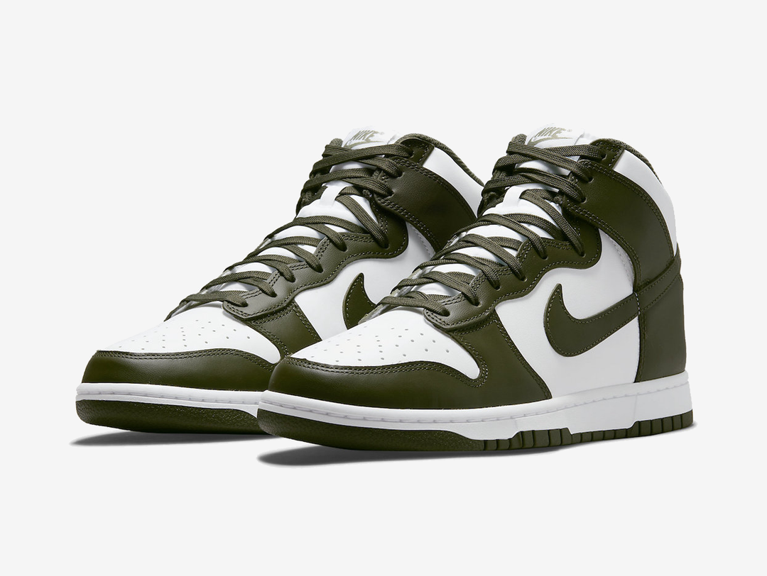 Classic Nike Dunk shoes with a white and green colourway.