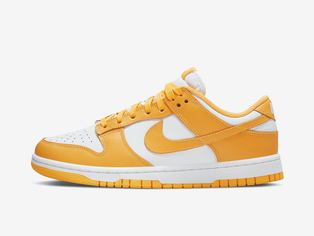 Classic Nike Dunk shoes with a white and yellow colourway.