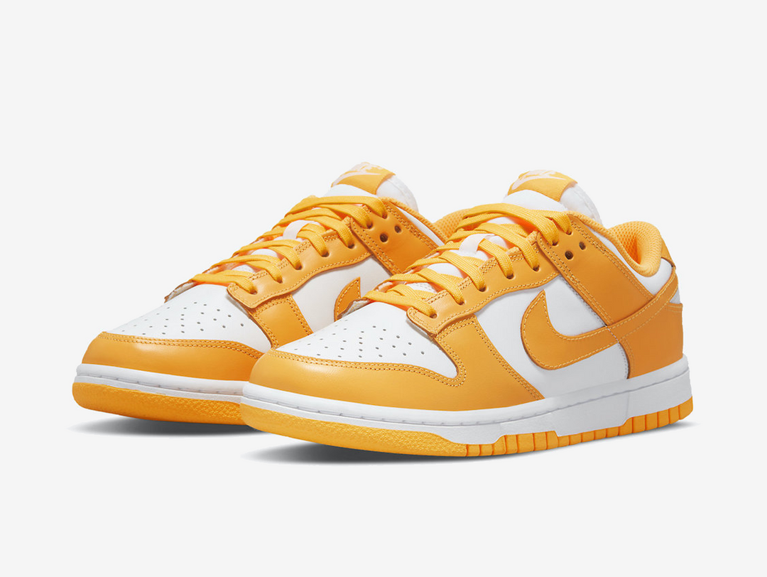 Classic Nike Dunk shoes with a white and yellow colourway.