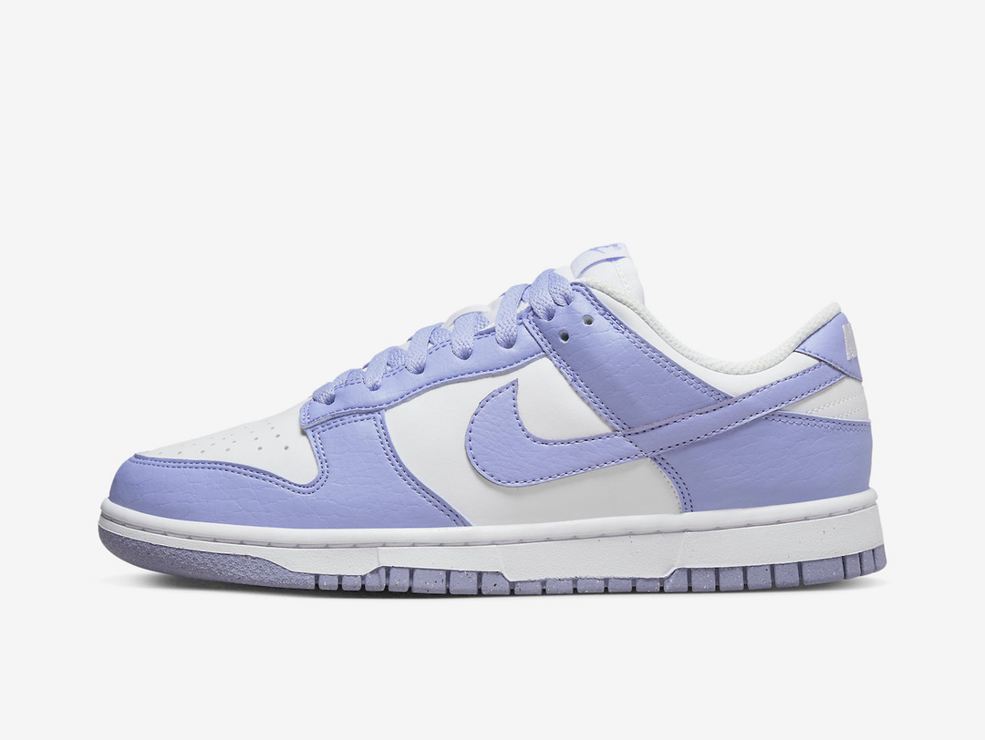 Classic Nike Dunk shoes with a white and purple colourway.