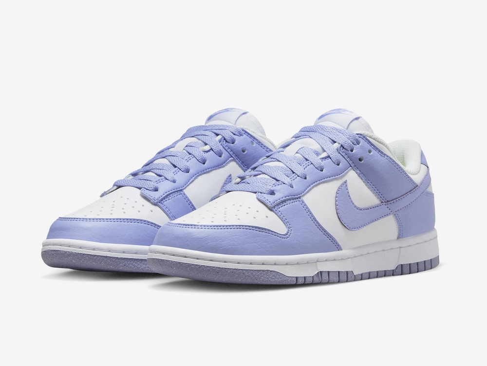 Classic Nike Dunk shoes with a white and purple colourway.