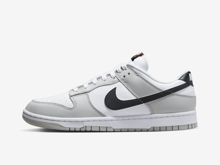 Classic Nike Dunk shoes with a white and grey colourway.