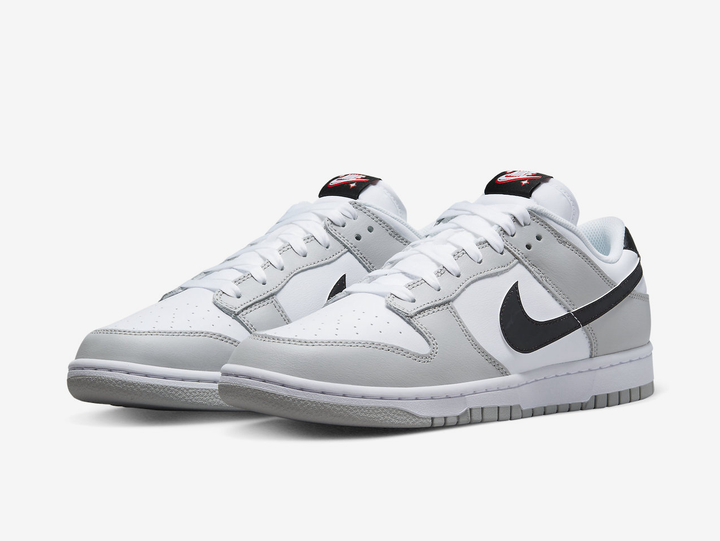Classic Nike Dunk shoes with a white and grey colourway.